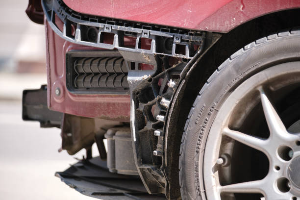 dented car with damaged fender parked on city street side. road safety and vehicle insurance concept - fender bender imagens e fotografias de stock