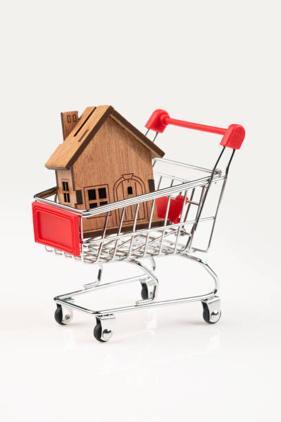 istock Shopping cart and house 1364083908