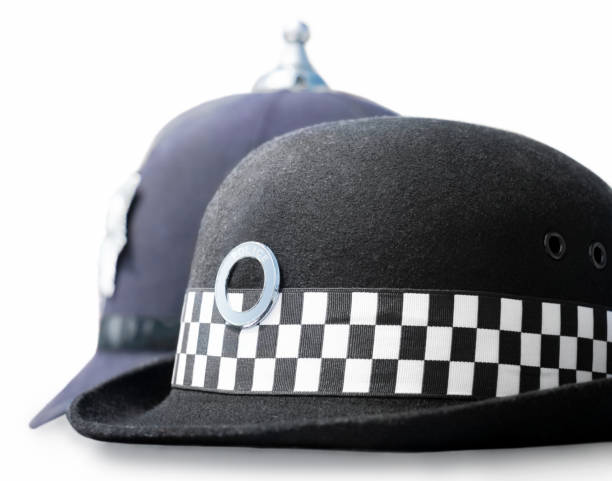 男性と女性の警察のヘッドギア - police helmet ストックフォトと画像