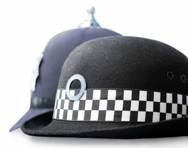 men's and women's police headgear - police helmet imagens e fotografias de stock