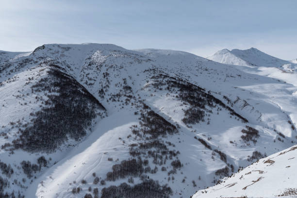 istock High snow covered mountains. Winter mountains landscape. 1364084758