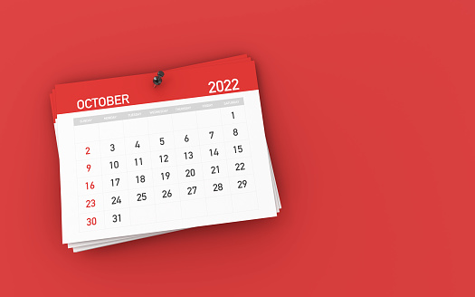 Calendario de Octubre Rojo 2022 y Sujetador en Fondo Rojo foto de archivo photo