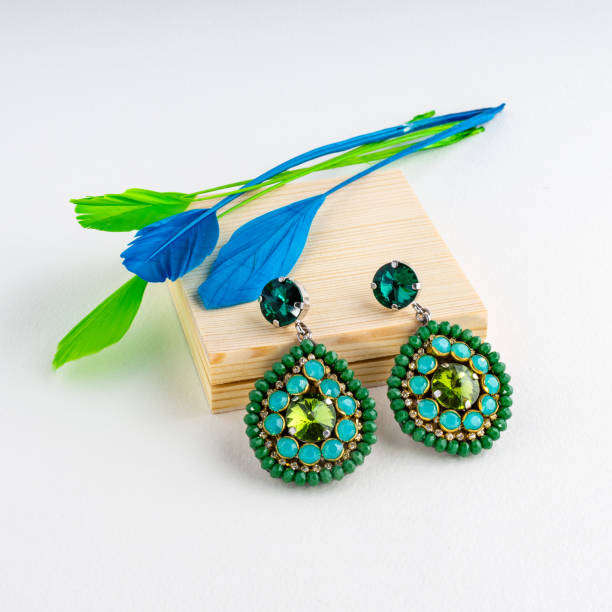 istock Trend fashionable earring on table presented for show 1364090979