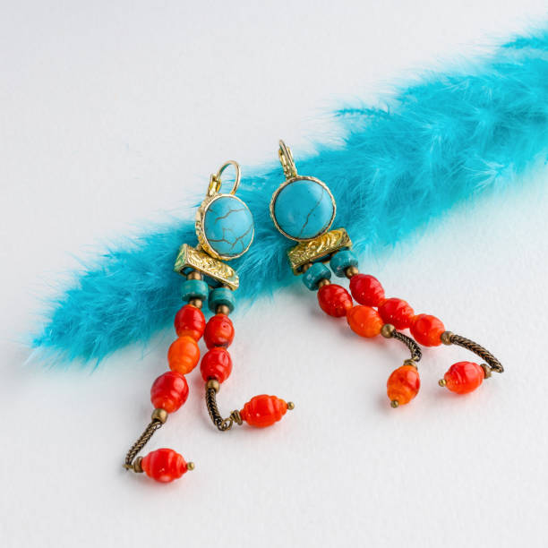 istock Trend fashionable earring on table presented for show 1364091272