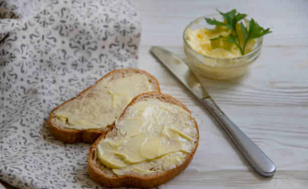 istock bread with butter on a wooden background 1364091996