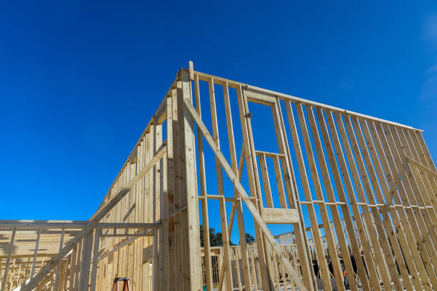 istock Wood building frame on a new development framing house under construction 1364092137
