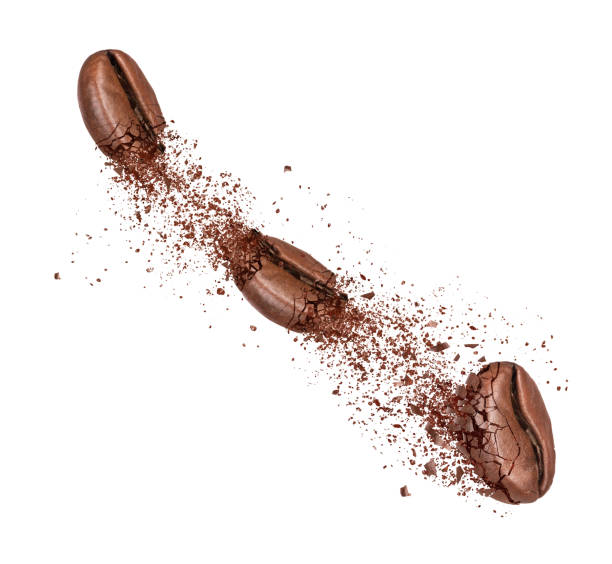 istock Three coffee beans are broken into powder in the air 1364092463