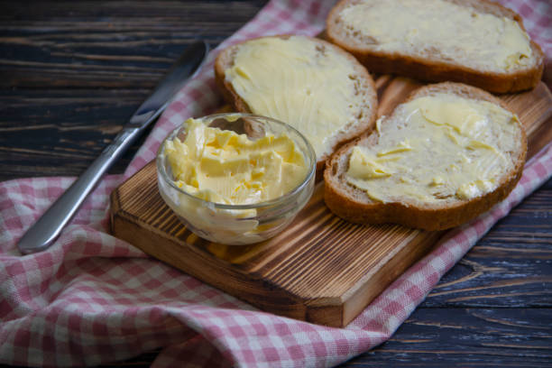 istock bread with butter on a wooden background 1364093191
