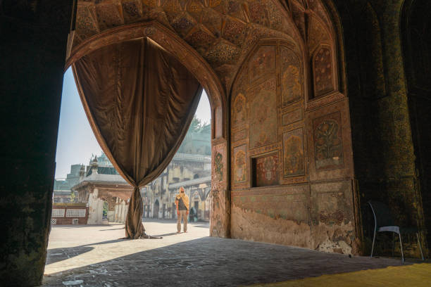 istock Man walking in the mosque in Lahore 1364094360