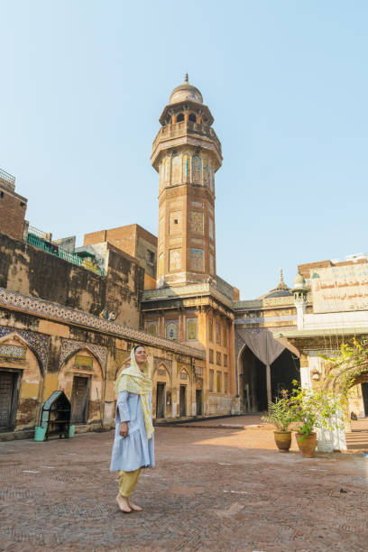 Woman in hijab  walking in mosque