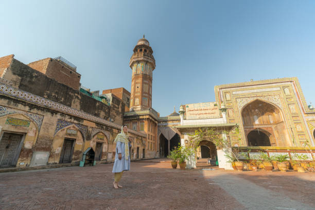 istock Woman in hijab  walking in mosque 1364094468