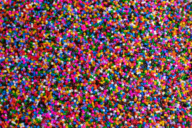 istock Small cylindrical pieces of plastic of multiple colors 1364094581