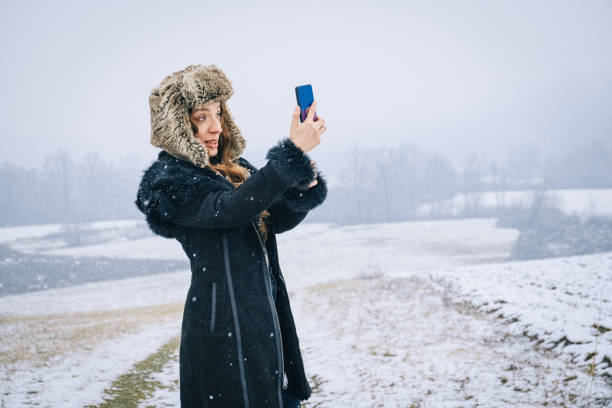 istock Woman using smart phone in the nature 1364094850
