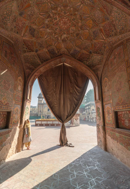 istock Woman in hijab  walking in mosque 1364095534