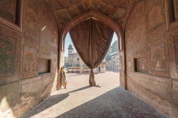 istock Woman in hijab  walking in mosque 1364095539