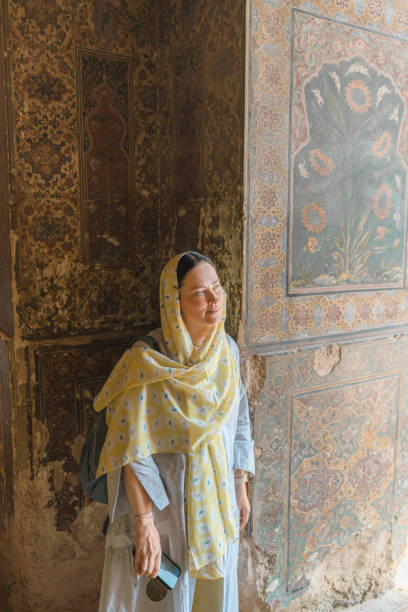 istock Woman in hijab  walking in mosque 1364095548