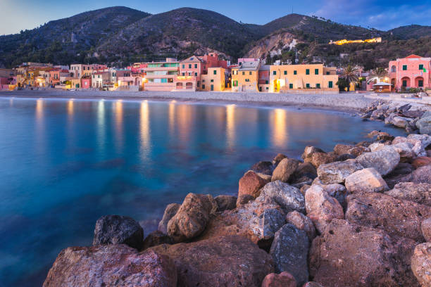 View of the beach of Varigotti during blue hour. Liguria, Italy View of the beach of Varigotti during blue hour. Liguria, Italy. finale ligure stock pictures, royalty-free photos & images