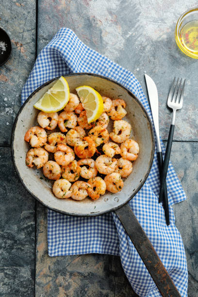 istock Tasty fried shrimps on pan 1364095903