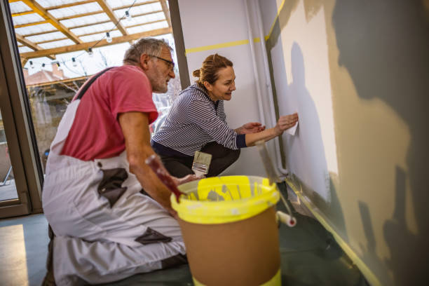 istock Painting walls together 1364098931
