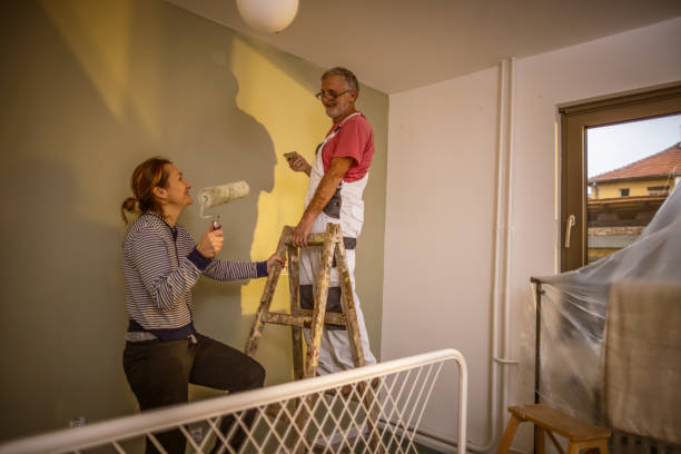 istock Painting walls together 1364099126
