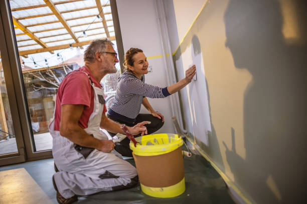 istock Painting walls together 1364099848