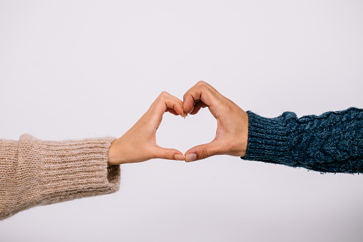 Diverse hands with love sign