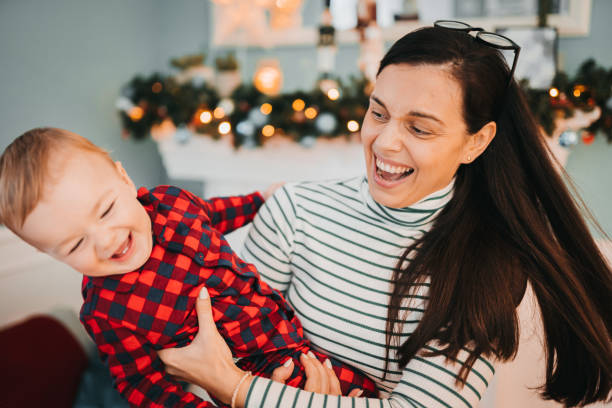 istock Mother and son playing for Christmas 1364103141