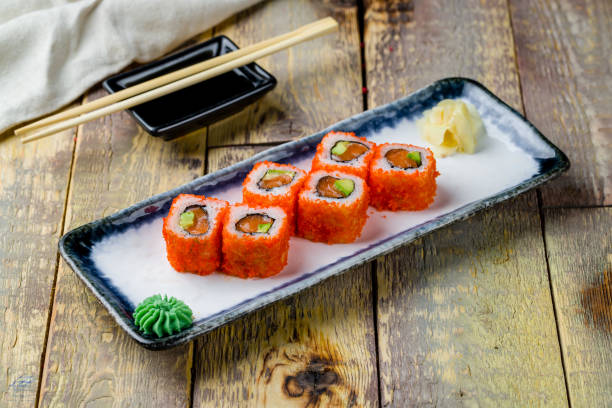 istock California roll with salmon on wooden table 1364104064