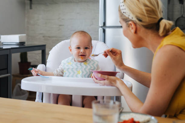 istock Woman Feeding the Baby 1364104442