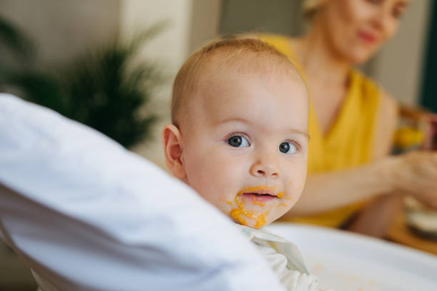 istock Portrait of a Baby Having a Breakfast 1364104454