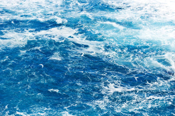 istock Ocean wave background. Bubble water backdrop. Turbulent sea texture. Messy water flow. 1364105223