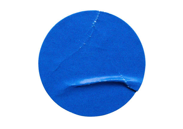 istock Blank blue round adhesive paper sticker label isolated on white background 1364110540