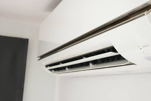 istock Air conditioner on white wall room interior background 1364110619
