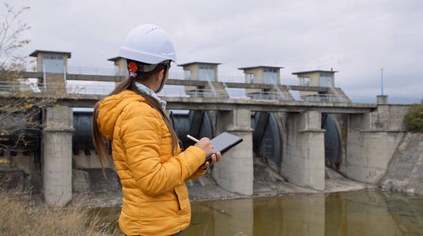 istock Female engineer working in hydroelectric dam. Ecology orientated. Renewable energy systems. 1364110747