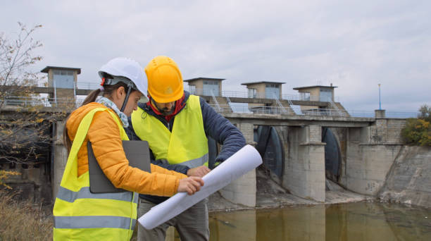 istock Maintenance engineers working in hydroelectric dam. Ecology orientated. Renewable energy systems. 1364110748