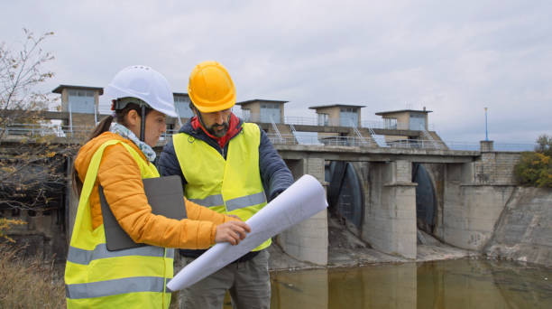 istock Maintenance engineers working in hydroelectric dam. Ecology orientated. Renewable energy systems. 1364110751