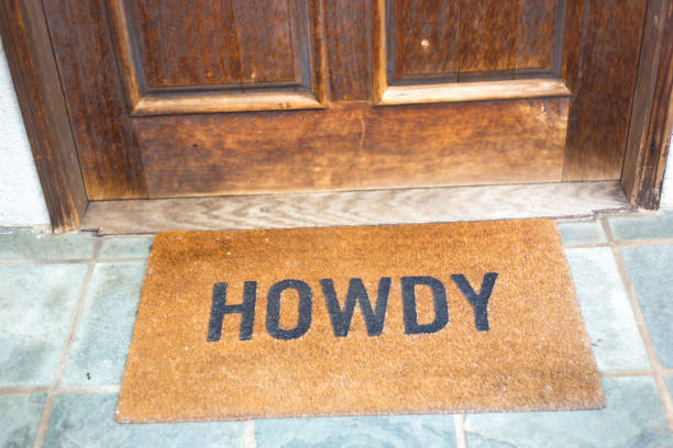 Welcome Mat at Old Wood Door Reading \