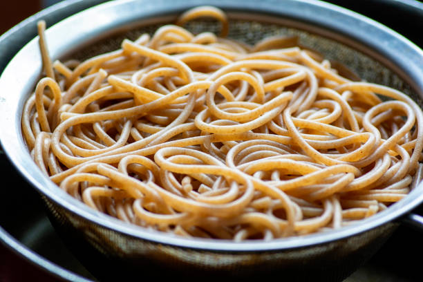 Close up italian raw pasta on bright background
