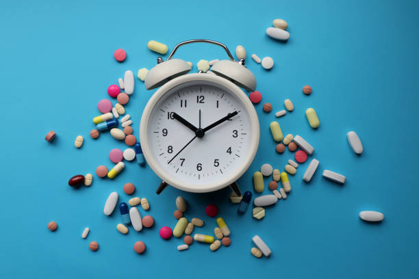 istock Alarm clock and pills 1364112823