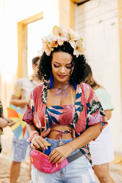 istock Care during Carnival. Young woman using sunscreen during carnival block 1364113718