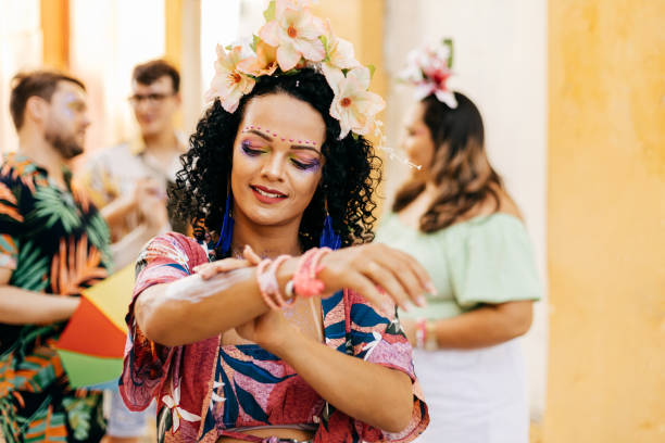 istock Care during Carnival. Young woman using sunscreen during carnival block 1364114236