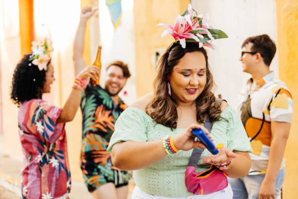 istock Care during Carnival. Young woman using sunscreen during carnival block 1364114239