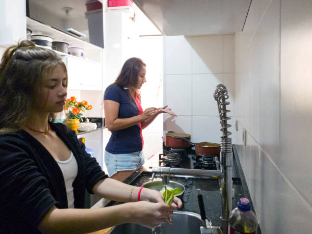 istock Mother and daughter cooking 1364114259
