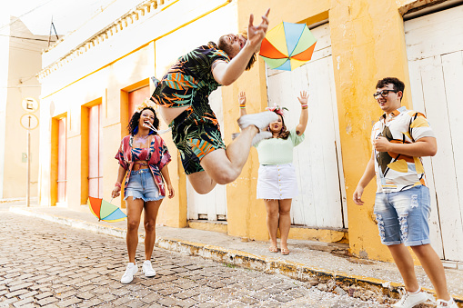 Brazilian Carnival. Group of friends dancing Frevo during street carnival block