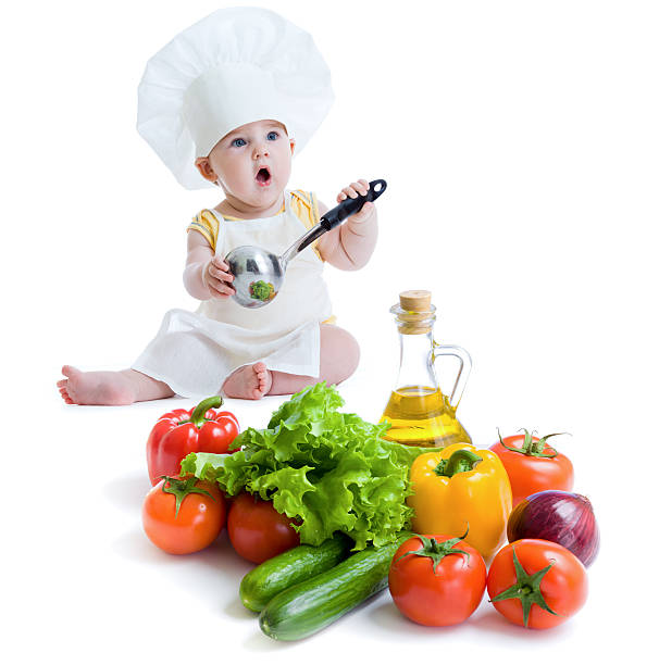 istock baby boy with healthy food 136411714