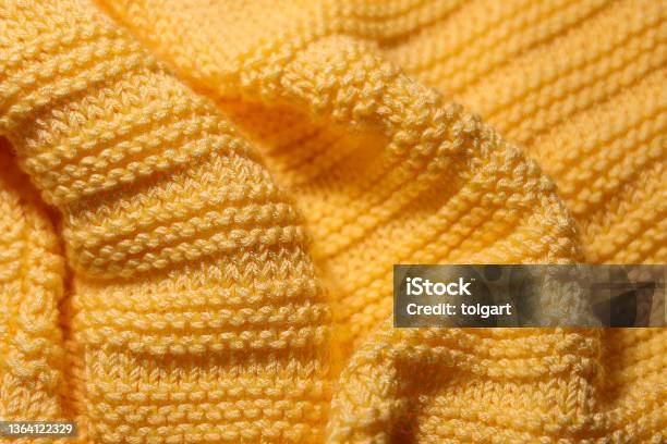Wavy Yellow Woolen Fabric Background Stock Photo - Download Image Now - Sweater, Textured, Yellow