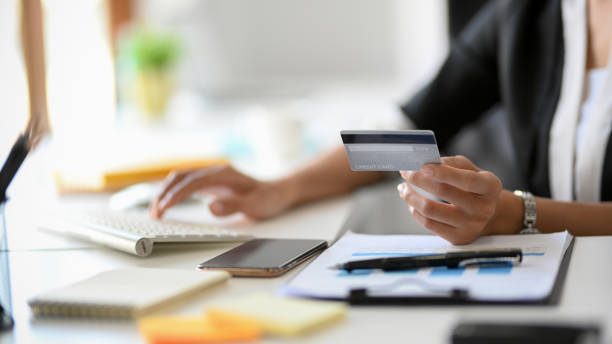 istock A female banker typing a credit card number on her desktop computer 1364124371