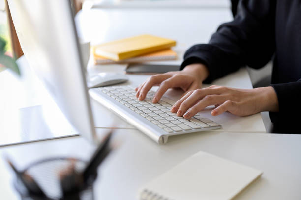 istock A female assistant or secretary working on desktop computer 1364124974