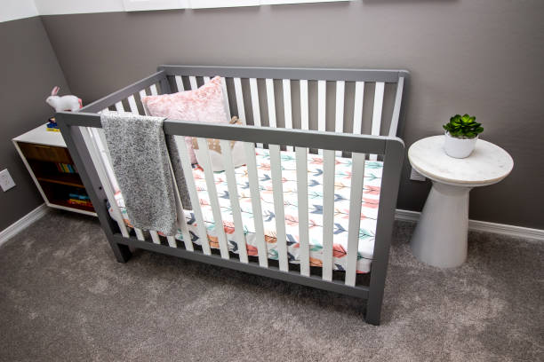istock Baby Crib With White Slats And Mattress 1364128253