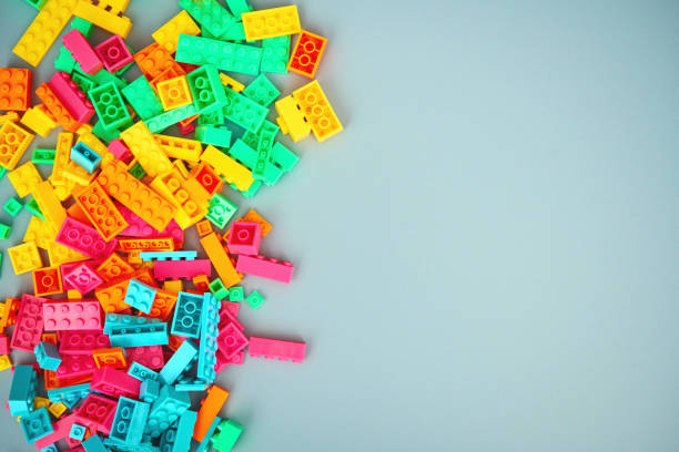 istock Colorful plastic toy bricks on a pale blue background with space for copy 1364131174